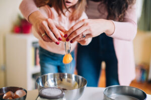 Mother and daughter cooking together